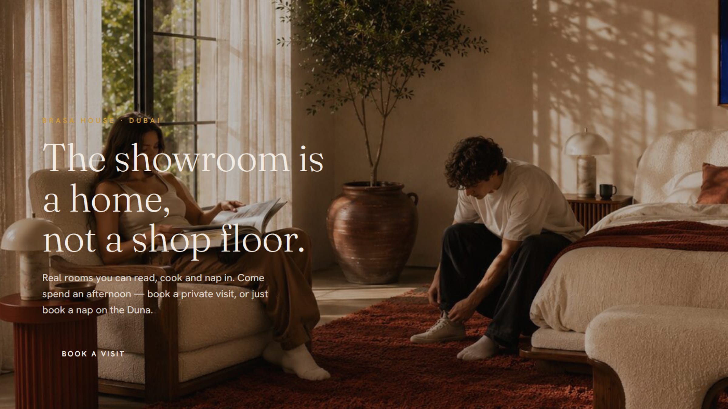 A couple resting in the sunlit Brasa House showroom in Dubai.