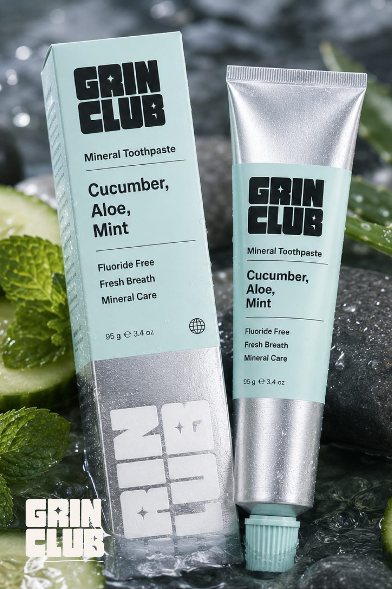 The aqua Cucumber box and tube on wet stones with cucumber slices.