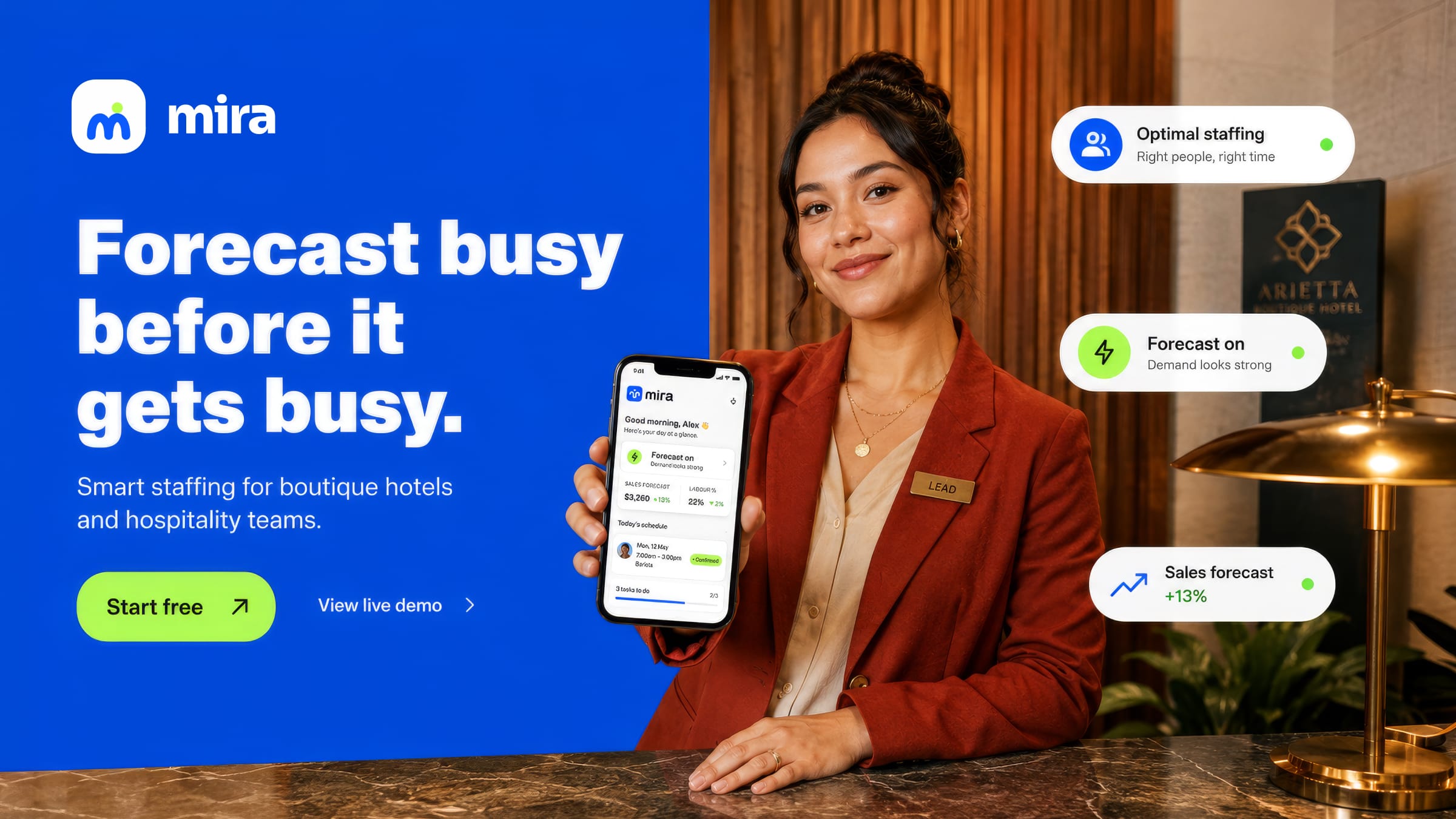 A hotel lead holds up the Mira app at a boutique hotel desk.