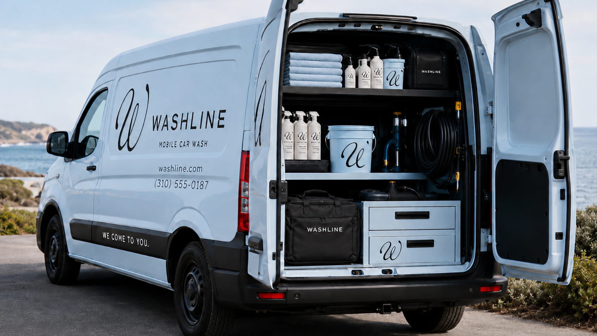 Branded bottles, buckets and hose stocked on the van's fitted shelves.